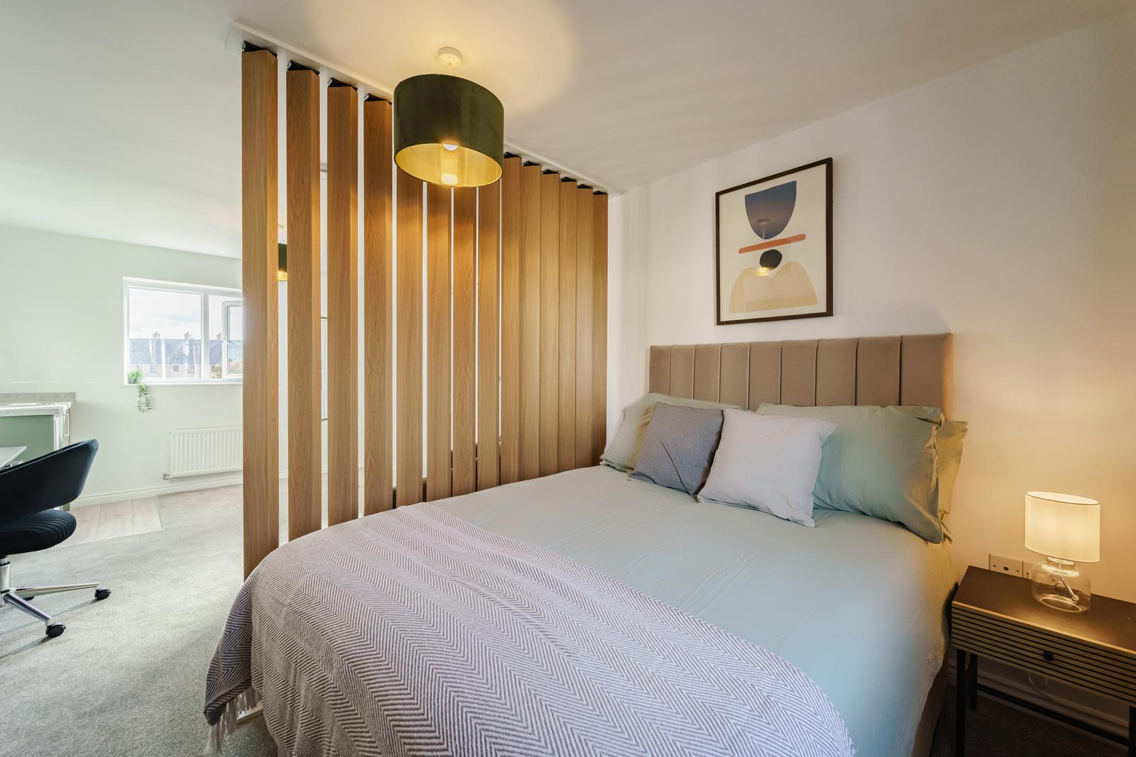 Room 6, double bed behind the timber screen